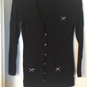 Black cardigan with silver details.